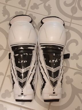 CCM LTP Youth Ice Hockey Shin Guards in White and Black